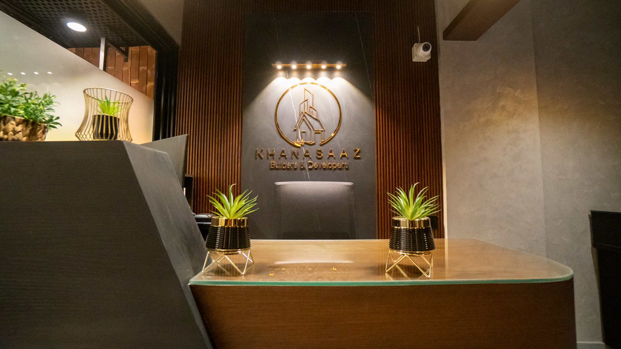 Collaborative studio desk beneath glazed roof